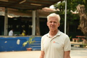 Jan Egeland standing in a school yard