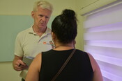 Jan Egeland listens to a woman affected by violence 